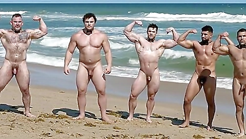 Muscular men on the beach have fun riding on one another
