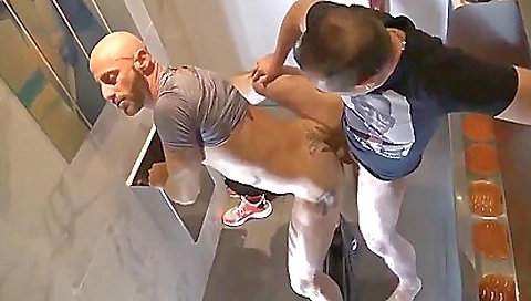 Tattooed woman receives a blowjob from a big cock dude