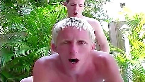 A skinny blonde is having fun with a dude in the pool
