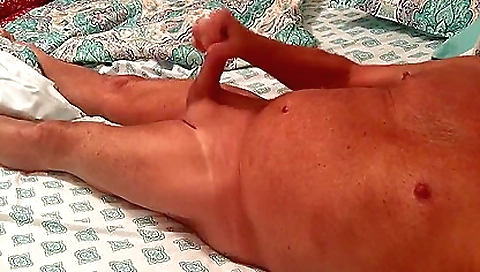 Mature woman enjoys being massaged in the massage room